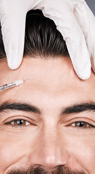 Man receiving BOTOX injection in forehead