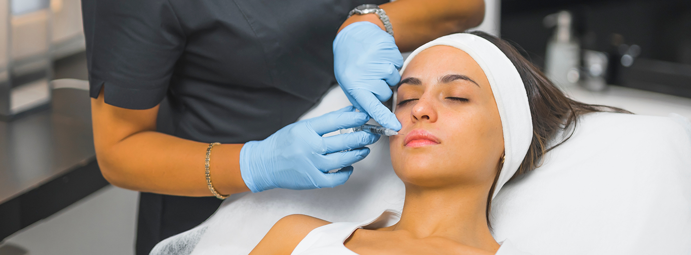 Woman receiving dermal fillers in Sterling Heights near lips