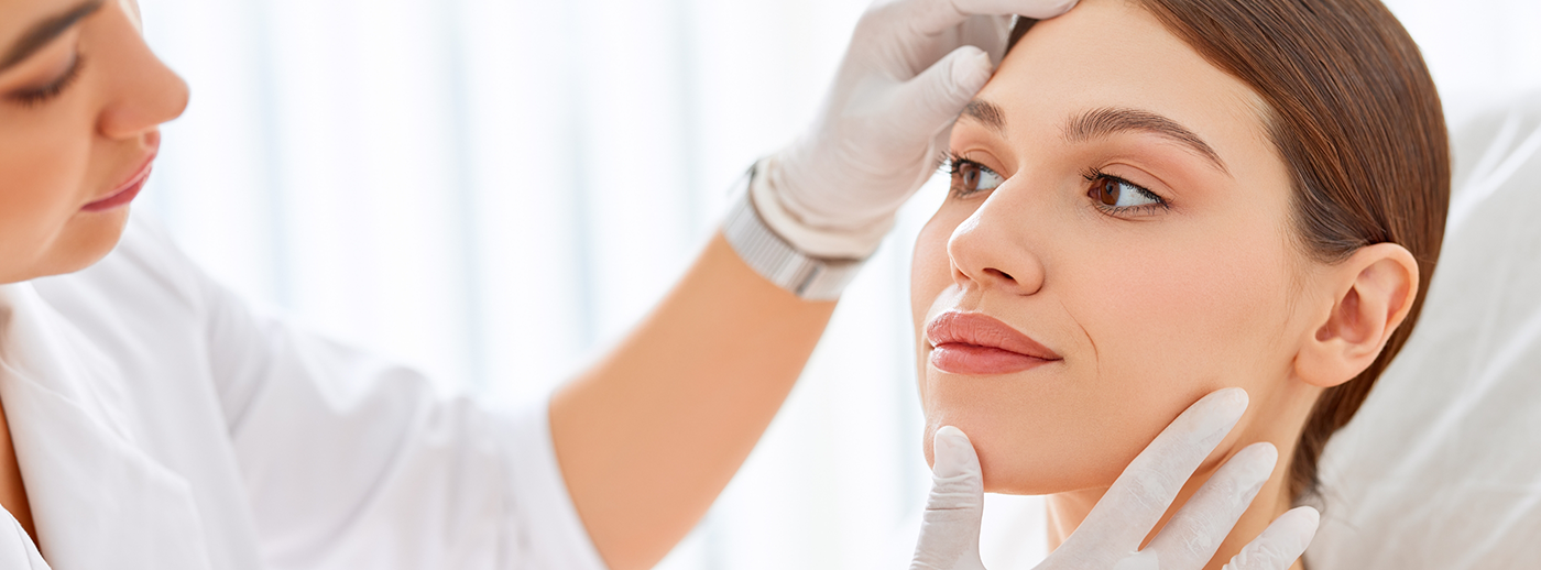 Esthetic expert taking look at patients forehead